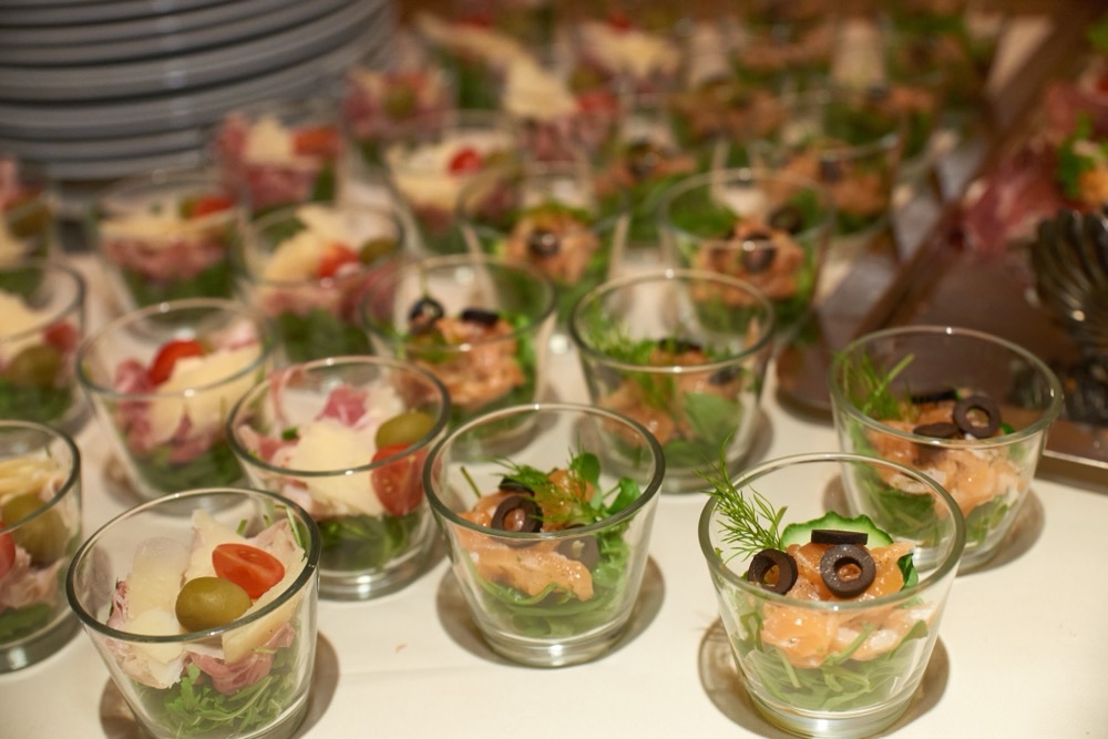 Starters served in cocktail glasses along the buffet table