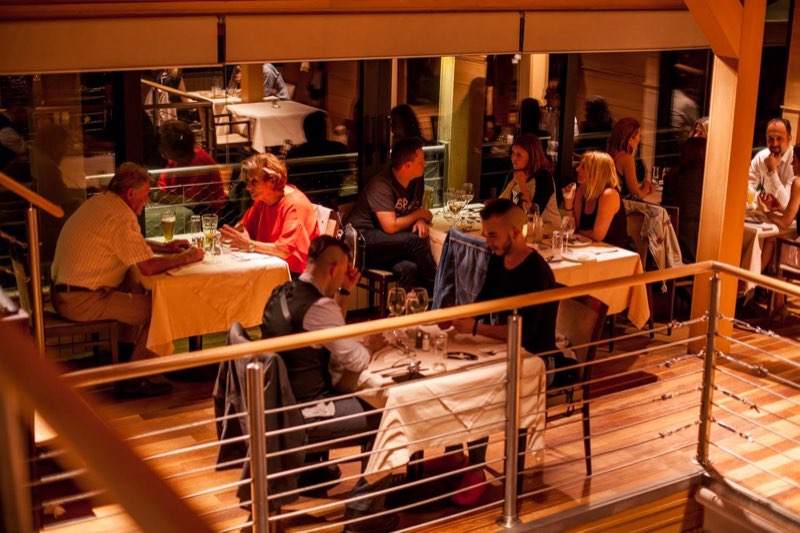 The upper level with its gallery, tables laid